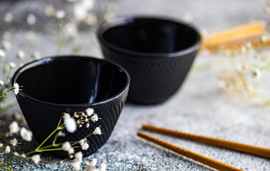 Spring table setting with first leaves and flowers