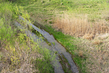 Dirt field road after rains and floods