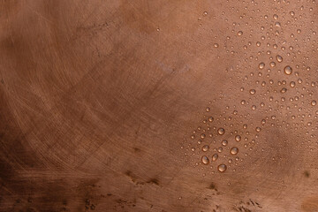 Copper background. Liquid drops. Selective focus.