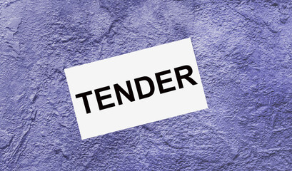 On a purple abstract background there is a white card with the text TENDER