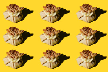 khinkali with cheese on a yellow background