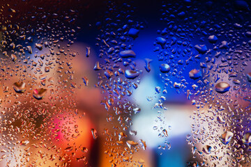 Condensation on the clear glass window. Water drops. Rain. Abstract background texture