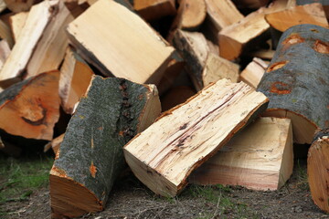 Detail of chopped firewood logs. Preparing for winter. Cut logs fire hardwood. Heating. Expensive energy.