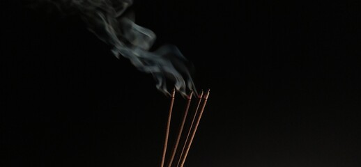 Aromatic agarbathi, agarbatti or Incense sticks smoldering in room with smoke and aroma. Isolated...