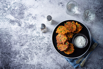Sweet potato hash browns with sauce in a plate