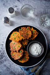 Sweet potato hash browns with sauce in a plate