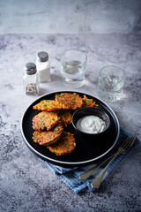 Sweet potato hash browns with sauce in a plate