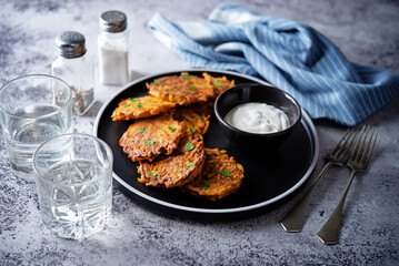 Sweet potato hash browns with sauce in a plate