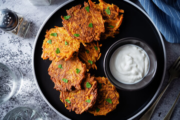 Sweet potato hash browns with sauce in a plate