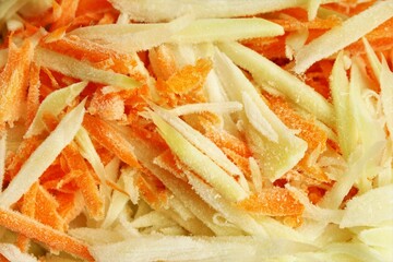 Frozen chopped papaya and carrot. full frame photo close up top view