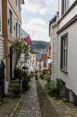 Fototapeta na wymiar Beautiful narrow street in downtown of Bergen, Norway in summer