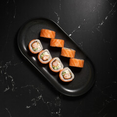 Philadelphia sushi roll with salmon, cucumber, shrimp, cream cheese. Sushi menu. Japanese food