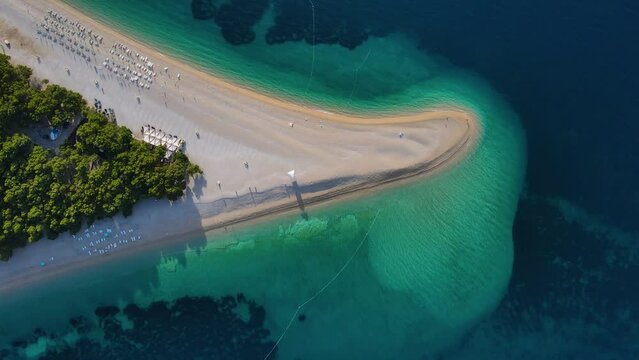 Aerial view of Zlatni Rat sandy beach in Adriatic sea on Brac island, Dalmatia, Croatia. 4k drone video. Summer vacation resort