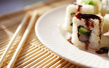 Close up sushi rolls on plate. Japanese food banner. 
