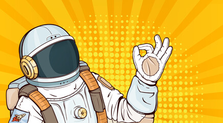 Astronaut in spacesuit showing ok gesture pop art vector illustration. Cosmonaut in helmet, uniform costume for space exploration and flight in cosmos gesturing okay sign on yellow halftone background