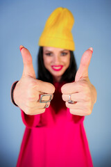 Young girl showing thumbs