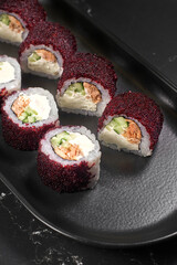 California sushi roll with crab meat, avocado and masago caviar. Close up view