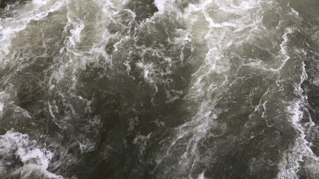 4K video. The flow of a mountain river. Natural background. Fast water. Fragment. Template for titles