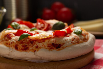 Pizza and sauce homemade cooking with ingredients on table. Pizza at tabletop