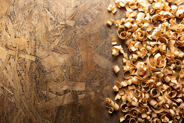 Wood shavings on table background. Wooden shaving at old plank board