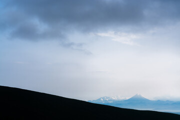 Vilyuchinsky volcano in Kamchatka from the far distance in the evening