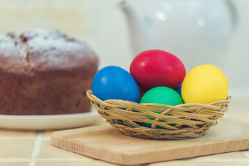 Fototapeta na wymiar Painted Easter eggs in a wicker bowl.