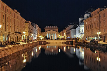 Night view of canal grande in Trieste with church of Sant'Antonio in the background