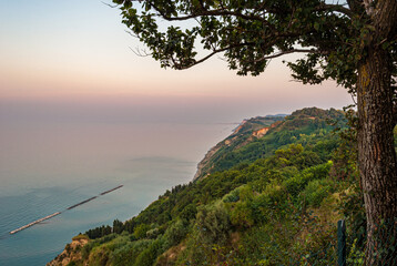 Coastline along the mount San Bartolo after the sunset, near Pesaro. Marche, Italy