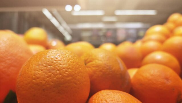 Tangerines (mandarins) lie on the supermarket shelves or fruit shop. Closeup