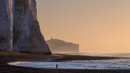 Mid-winter early morning light on the Seven Sisters and Belle Toute light house from Cuckmere Haven, East Sussex, UK
