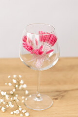 Pink makeup brushes, combs for eyelashes and eyebrows.