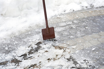 Ice breaking tool. Cleaning the road with icebreaker tool. Ice removal in spring.