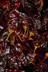 Dyeing chilies placed on a shelf for sale within a market