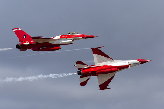 Avalon, Australia - March 1, 2015: Republic of Singapore Air Force (RSAF) Lockheed Martin F-16CJ Fighting Falcon fighter aircraft of the Black Knights display team flying in formation.