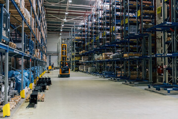 Forklift loader in Modern warehouse interior with shelves and boxes