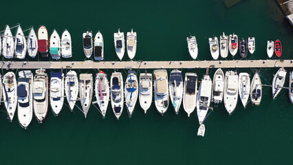 Top view of boats in Procida, Italy, the most popular tourist attractions on the beach. Action. Yacht parking, yacht and sailboat is moored at the quay