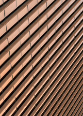 Vertical Building exterior with bronze reflective glass screen at Salt Lake City in Utah