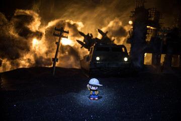 Silhouette soldier carrying little boy on his shoulder from fire. Rescue savior concept. Man moving...