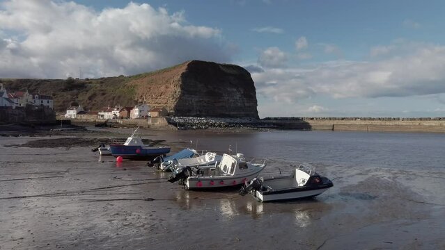 Low tide at Staithes, Yorkshire with fishing boats