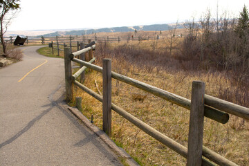 Fototapeta na wymiar Parks Trails Wooden Fence Railing with Prairie Foothills View