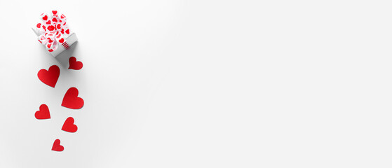 Gift for Valentine's Day and red paper hearts on white background with space for text