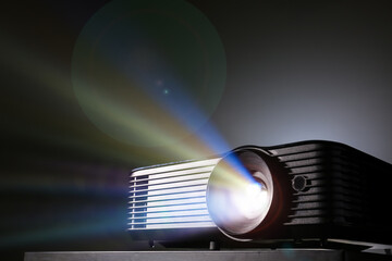 Modern video projector on black background