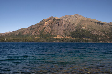 View of Gutierrez lake in Bariloche, Patagonia Argentina. The turquoise water, rocky shallows and...