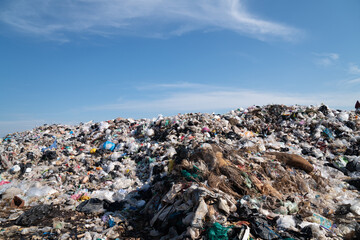 UBOLRATTHANI THAILAND- FEB 21: People collect  gabage from  Removal and landfill waste from industry and households in rural grasslands. Jebruary 10, 2022 in Ubolrat thani province,Thailand