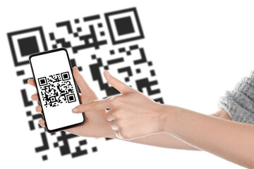 Hands of woman with smartphone scanning QR code on white background