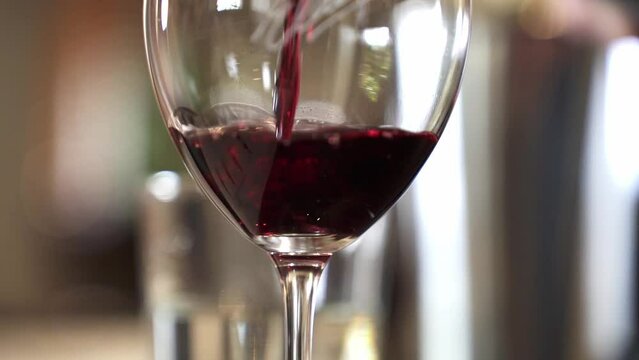 Pouring Red Wine Into The Wine Glass In Barossa Valley, Adelaide, South Australia. - close up