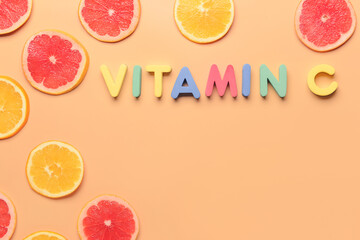 Text VITAMIN C made of colorful letters and citrus fruits on color background