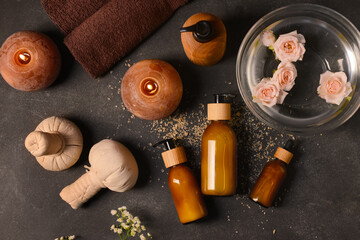 Composition with spa accessories and cosmetics on dark background