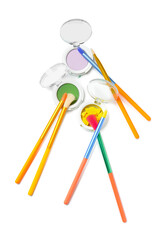 Colorful makeup brushes with eyeshadows on white background