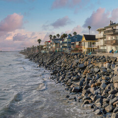 Square Puffy clouds at sunset Residential buildings at the coastal area of Oceanside, Californ
